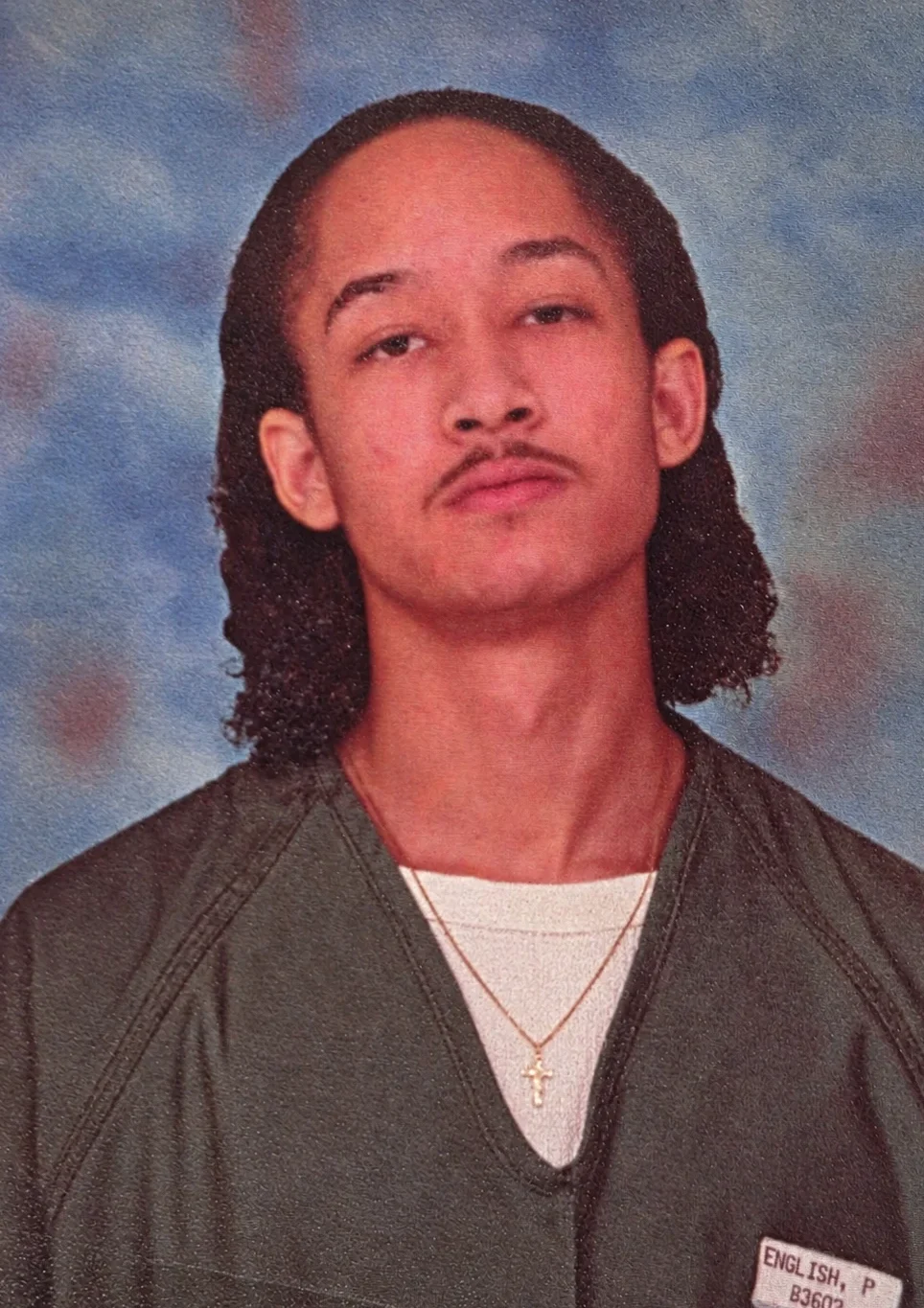 Portrait of Paul as a young man in a prison uniform